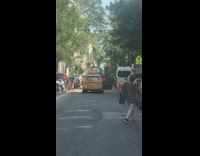 Prius Taxi car drives down the street with right door wide open