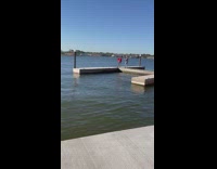 Woman red top walk boat dock heels