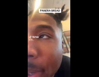 Man whistling while talking at Panera bread 