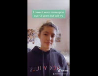 Girl puts on makeup for job interview 