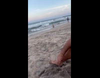 Woman beach dress bend pose at shore