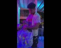 Guy pours shot down girls mouth while holding her throat 