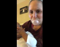Baby scared of mom blowing bubblegum