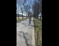 Man gray long coat walk back and forth park photo shoot
Name of submitter and credit can't confirm.
