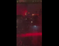 Lady climbs above crowd at club 