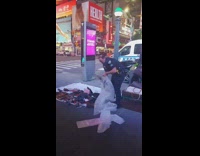 Cop puts persons stuff inside bag 