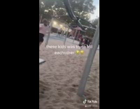 Little kids line park swing 