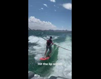 Red wakeboard guy catches can boat lake