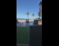 Woman in bikini pushups on the poolside