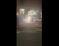 Man walks through the lit fireworks fountain