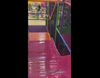 Little boy rides scooter bike down huge slide 