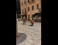 Two medieval knights with sword spar on street