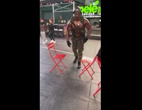 Guy in soldier costume does workout then orders filmer to do 20 pushups 