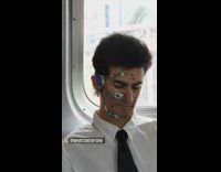 Man with robot apparatus on face train