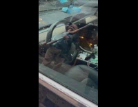 Tesla parked with club on wheel 