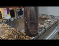 Bottle shaped ice with water inside real bottle