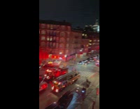 Man shows street full of firefighters putting out fire
