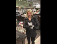 Woman puts nothing into grocery bag