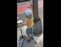 Kid with scooter keeps pressing walk button 