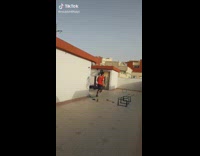 Guy practices playing soccer with tiny kitten 