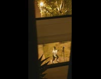 Woman white top photo shoot sidewalk nighttime