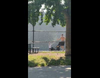 Kid plays with bubbles while dad works out