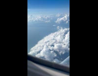 View of sky and clouds from plane