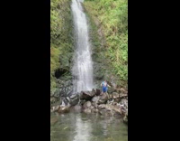 Man open blue shirt waterfall picture