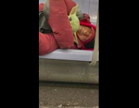 Man sleeps with baby Yoda on train