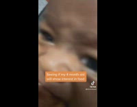 Mom gives a sandwich to her son 