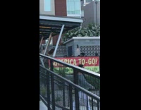 Girl walks back forth dances restaurant patio 