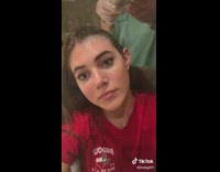 Girl red shirt dying hair 