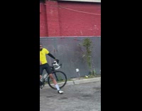 Man uses hand pump to put air into tires