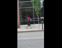 Red sweater guy walks sidewalk danes selfie 