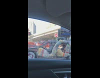 Post apocalyptic scrapyard design looking vehicle passing by