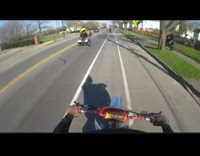 Guy doing wheelie on dirt bike falls 