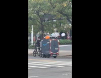 Amazon rider drives with pumpkin on cargo