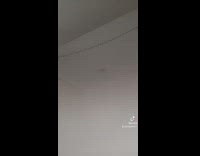 Girl recording herself with bright flash on 