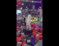 grey black spin foam pit girl hits head