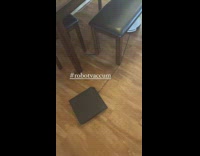 Robot vacuum dragging a ps4 on the floor