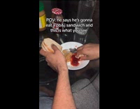 Man dips piece of bread on PBJ
