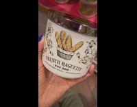 Girl with french baguette candle 