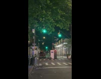 Guy uses cardboard to hit sneakers off a electricity line 