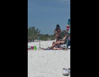 Woman red bikini look behind pose beach