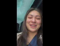 Girl crying in flipped over car 