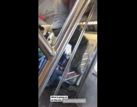 Guy does pull ups on train bar