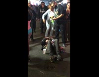 guy laying down on ground people walking over him