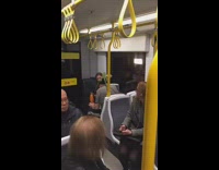 Man with two iguanas on top of head on metro train dramatic music