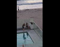 Woman semi formal dress pool beach pictorial