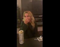 Girl in black shirt covers nose and does clown nose noise 